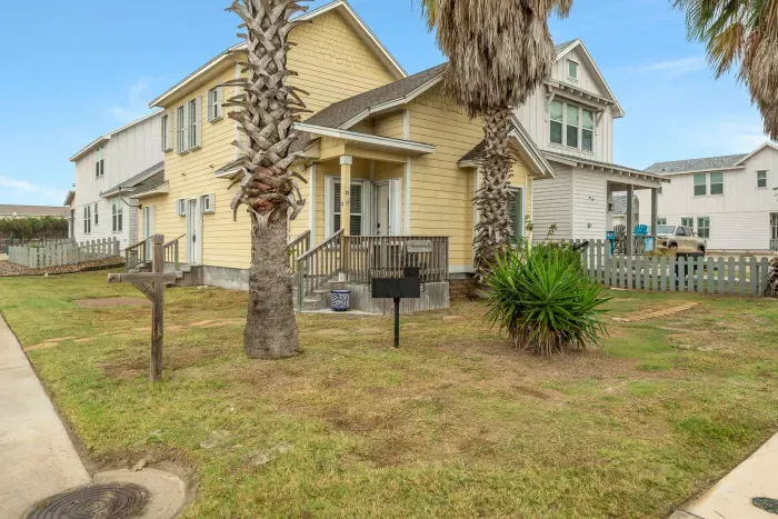 Charming coastal home with tropical landscaping and beach-town appeal.