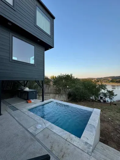 Relax in the private hot tub with scenic surroundings.