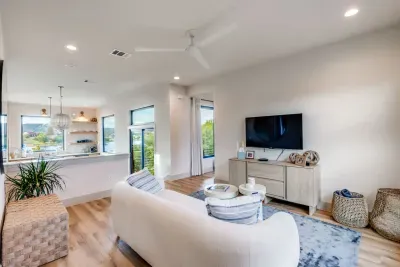 Open-concept living room with lake views and cozy seating.