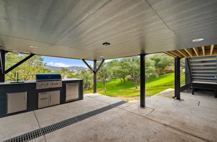 Covered outdoor kitchen and BBQ area perfect for entertaining.