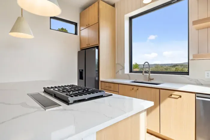 Contemporary kitchen with large windows and gorgeous views.