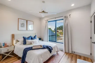 Peaceful bedroom with king bed and soft natural lighting.