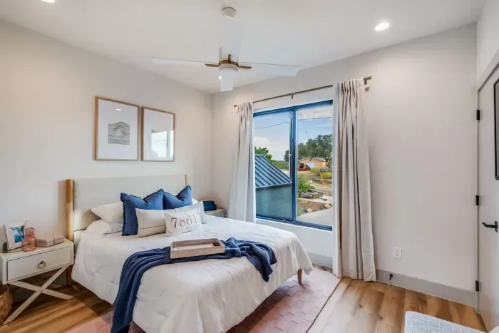 Peaceful bedroom with king bed and soft natural lighting.