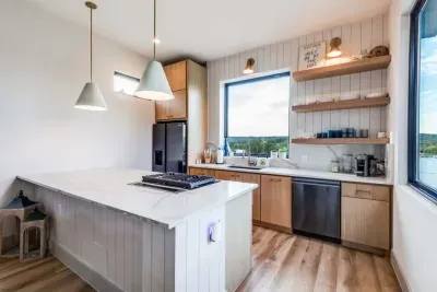 Modern kitchen with sleek design and plenty of natural light.