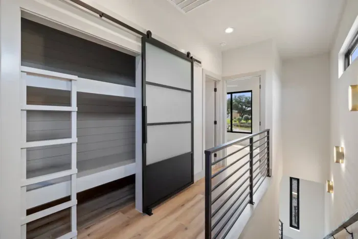 Built-in bunk beds with cozy blue bedding, perfect for kids or extra guests.