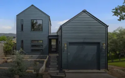 Modern front exterior with sleek design and private driveway.