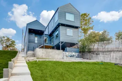 Another angle of the home’s modern exterior and landscaped entry.
