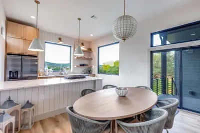 Another view of the kitchen and dining area with direct patio access.