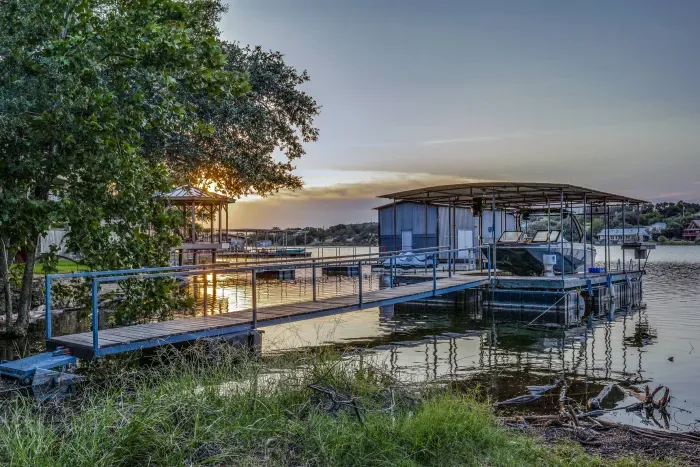 Lakeside dock glowing under the evening sky.
