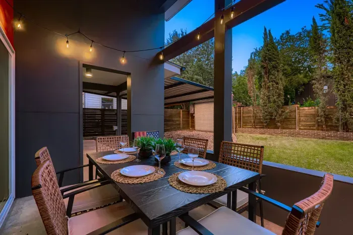 Outdoor dining under string lights—perfect for evenings with friends.