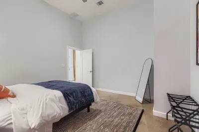 Minimalist guest room with soft linens for a restful night’s sleep.