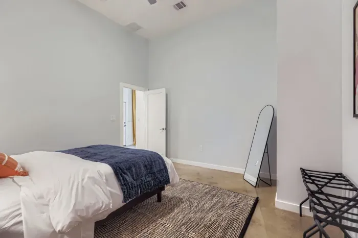 Minimalist guest room with soft linens for a restful night’s sleep.