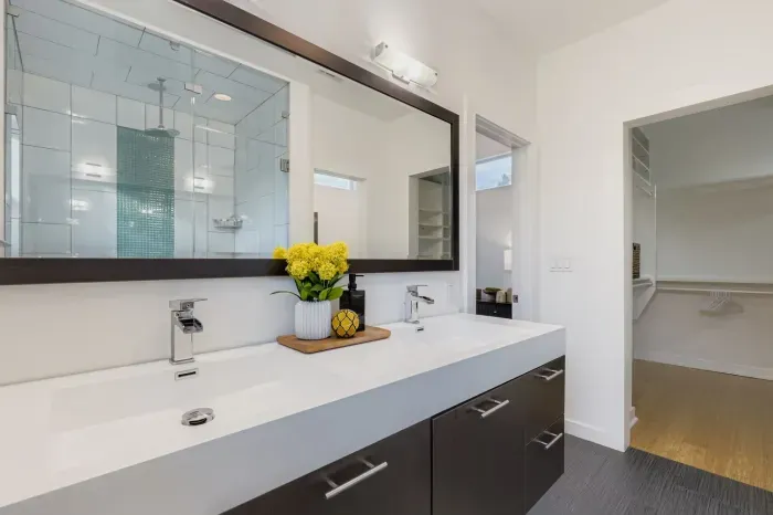 Double vanity with large mirror and fresh modern look.