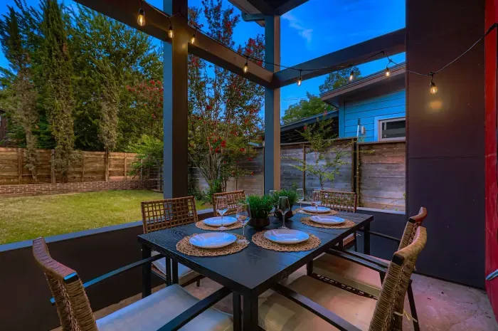Outdoor dining table set for family-style meals under the stars.