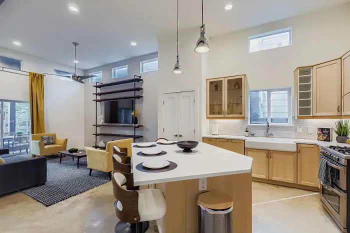 Modern kitchen with stainless steel appliances and plenty of counter space.