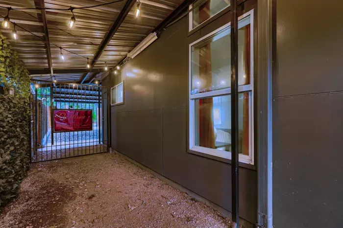 Side walkway with covered access to the backyard.