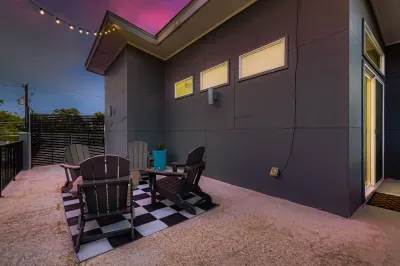 Charming outdoor hangout with string lights and modern seating.