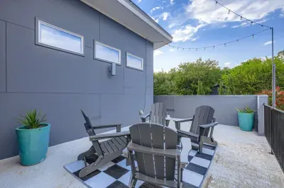 Outdoor patio with seating for relaxing under the sky.