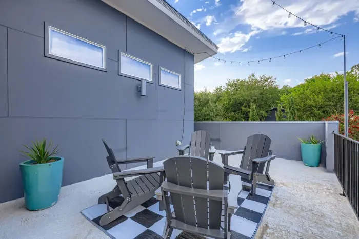 Outdoor patio with seating for relaxing under the sky.