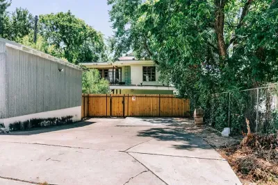 You'll park in the spaces next to the garage off the alley, walk through the gate, and you're home!