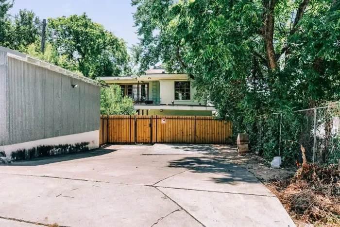 You'll park in the spaces next to the garage off the alley, walk through the gate, and you're home!