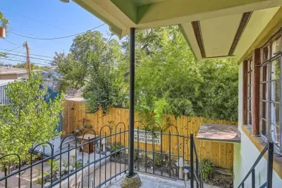 Discover the charming courtyard at the back, a peaceful oasis with lush greenery, comfortable seating, and a tranquil atmosphere. Ideal for morning coffee or evening relaxation, it offers a private escape."