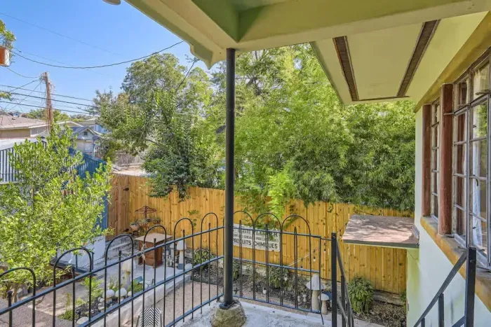 Discover the charming courtyard at the back, a peaceful oasis with lush greenery, comfortable seating, and a tranquil atmosphere. Ideal for morning coffee or evening relaxation, it offers a private escape."