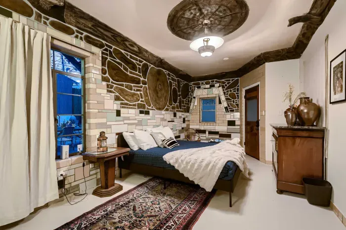 Cozy primary bedroom with natural light.