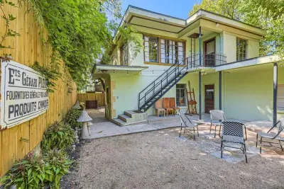 Well-manicured backyard with a variety of flowers and plants, creating a colorful and tranquil retreat.