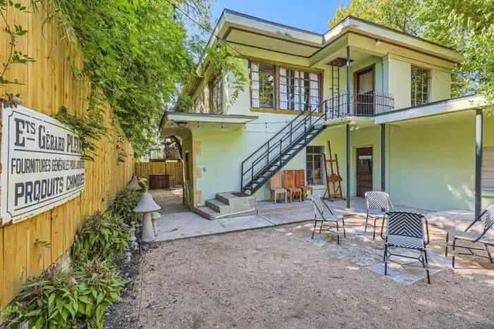 Well-manicured backyard with a variety of flowers and plants, creating a colorful and tranquil retreat.