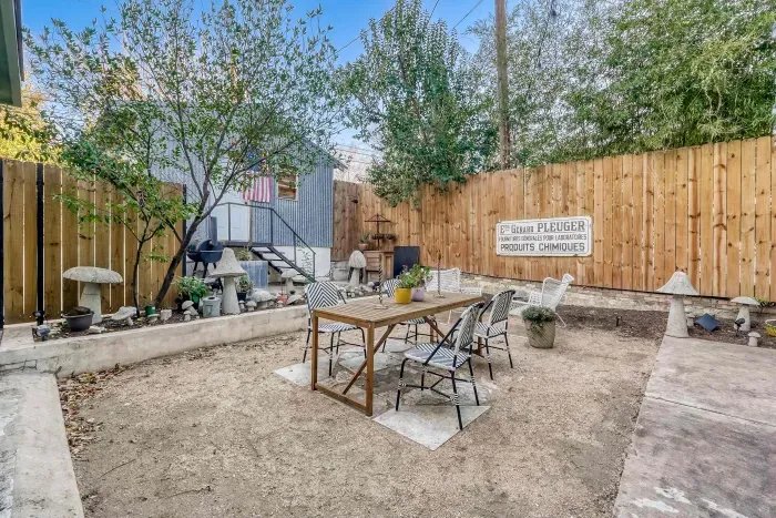 Spacious fenced backyard for outdoor use.