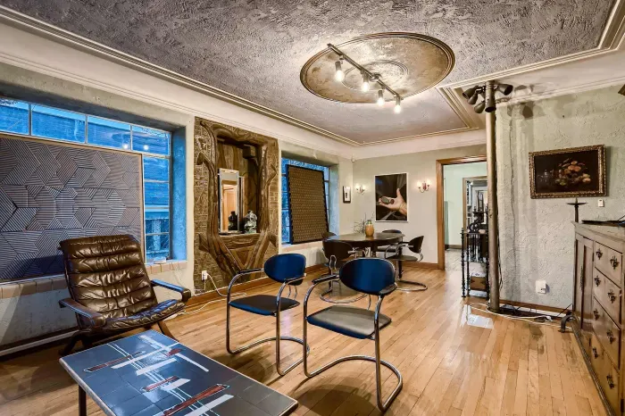 Spacious living room with artistic charm.