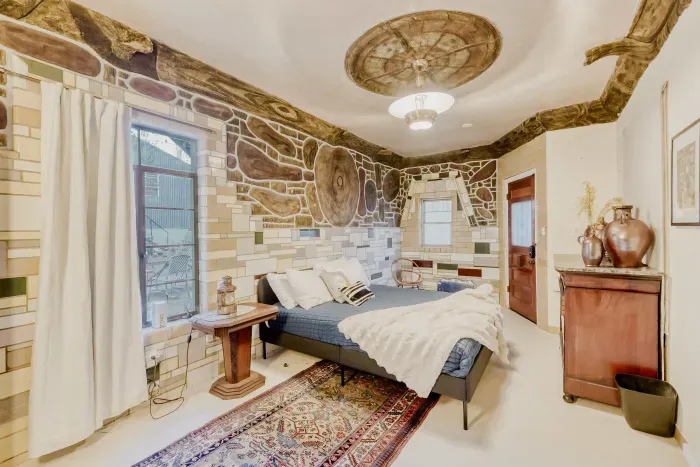 Cozy primary bedroom with natural light.