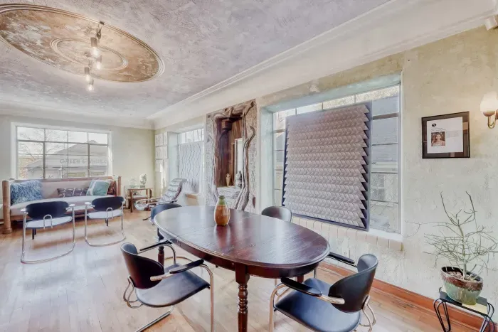 Dining area with natural light and seating.