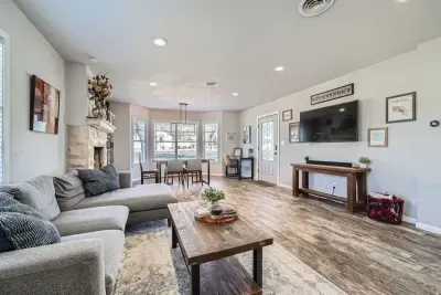 Beautifully integrated living room and dining space designed for comfort and functionality. This cohesive area allows for seamless entertaining and family gatherings, with ample natural light enhancing the ambiance.