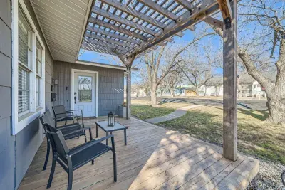 Charming exterior with a welcoming front porch and beautifully landscaped yard.