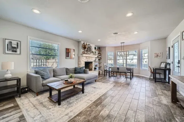 Beautifully integrated living room and dining space designed for comfort and functionality. This cohesive area allows for seamless entertaining and family gatherings, with ample natural light enhancing the ambiance.