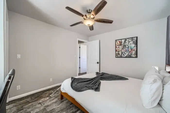 A bright and airy bedroom with a queen bed and ample sunlight pouring in, creating a peaceful retreat to relax and recharge.