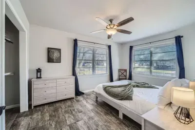 A contemporary queen-size bed and minimalist design create a peaceful, stylish atmosphere to rest in.