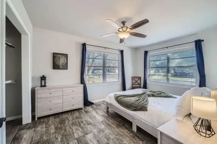 A contemporary queen-size bed and minimalist design create a peaceful, stylish atmosphere to rest in.