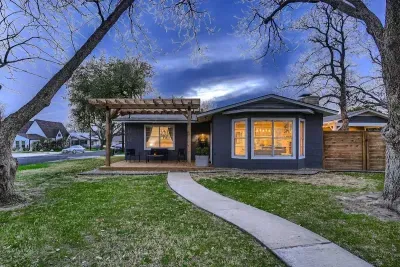 Charming exterior with a welcoming front porch and beautifully landscaped yard.