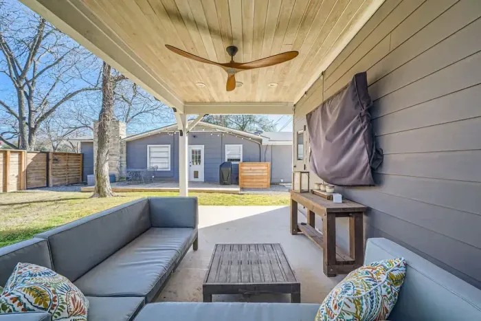 Escape to the spacious backyard, offering a peaceful retreat with outdoor seating and room to relax under the open sky.