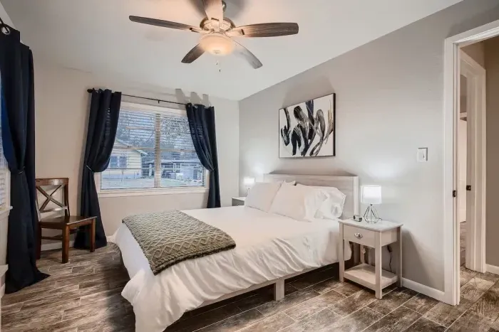 Guest-friendly bedroom with a cozy vibe and ample storage space.