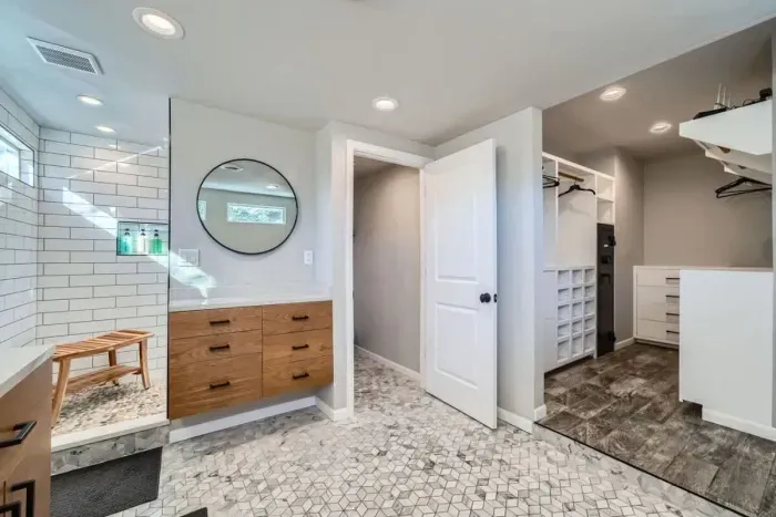 Modern bathroom with sleek fixtures, a spacious shower, and high-end amenities.
