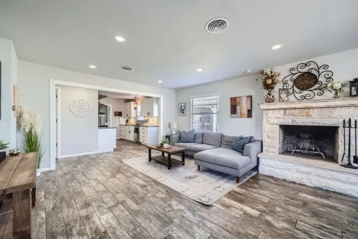 Beautifully integrated living room and dining space designed for comfort and functionality. This cohesive area allows for seamless entertaining and family gatherings, with ample natural light enhancing the ambiance.