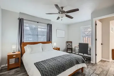 Peaceful bedroom with a plush queen-sized bed and soft linens for a restful night’s sleep.