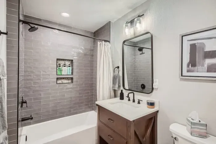 Bright and fresh bathroom with a combination tub and shower, perfect for unwinding.