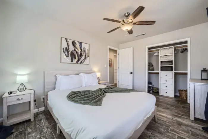 Featuring a queen-size bed and soft hues, this cozy room is a perfect retreat for quiet moments and restful nights.