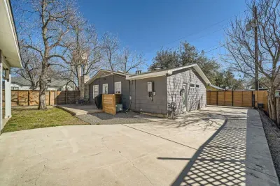 Private backyard oasis featuring a large deck, comfy seating, and a fire pit for cozy evenings.