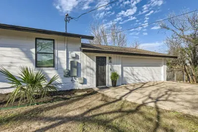 Welcoming entrance with charming curb appeal and lush landscaping.